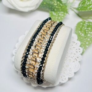 Gorgeous Wide bracelet featuring gold tone chains, rhinestones and beads